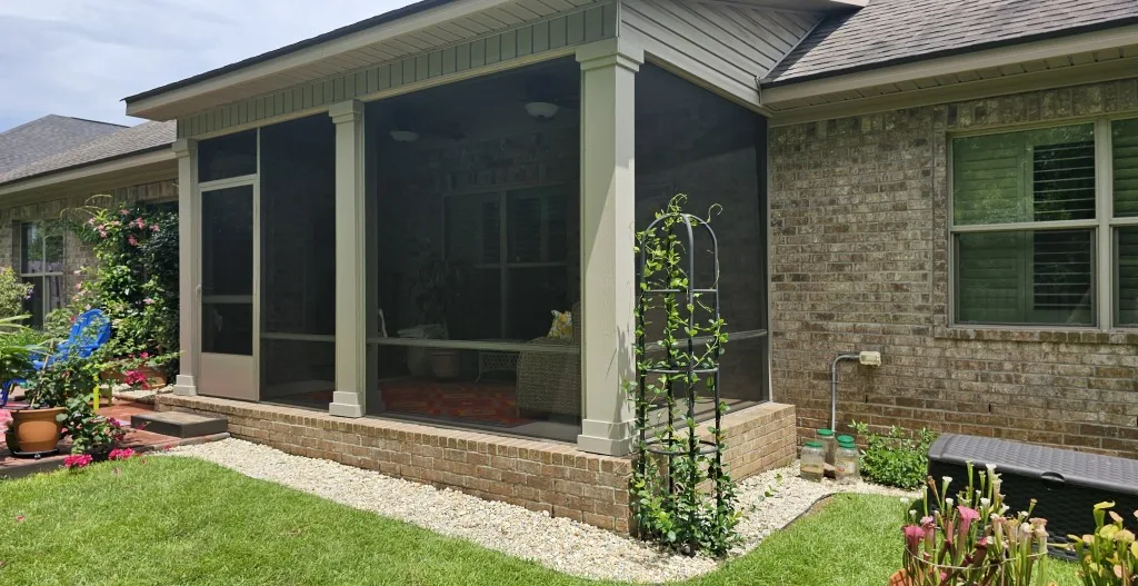 Custom screened patio installed on a home