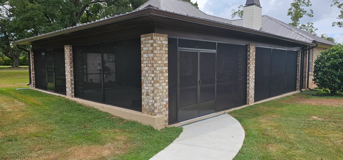 Large screened porch and patio enclosure with brick columns